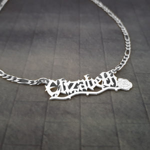 a silver necklace with a name on it