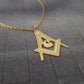 a gold necklace with a masonic symbol on it