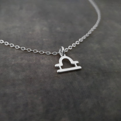 a silver necklace with a heart on it