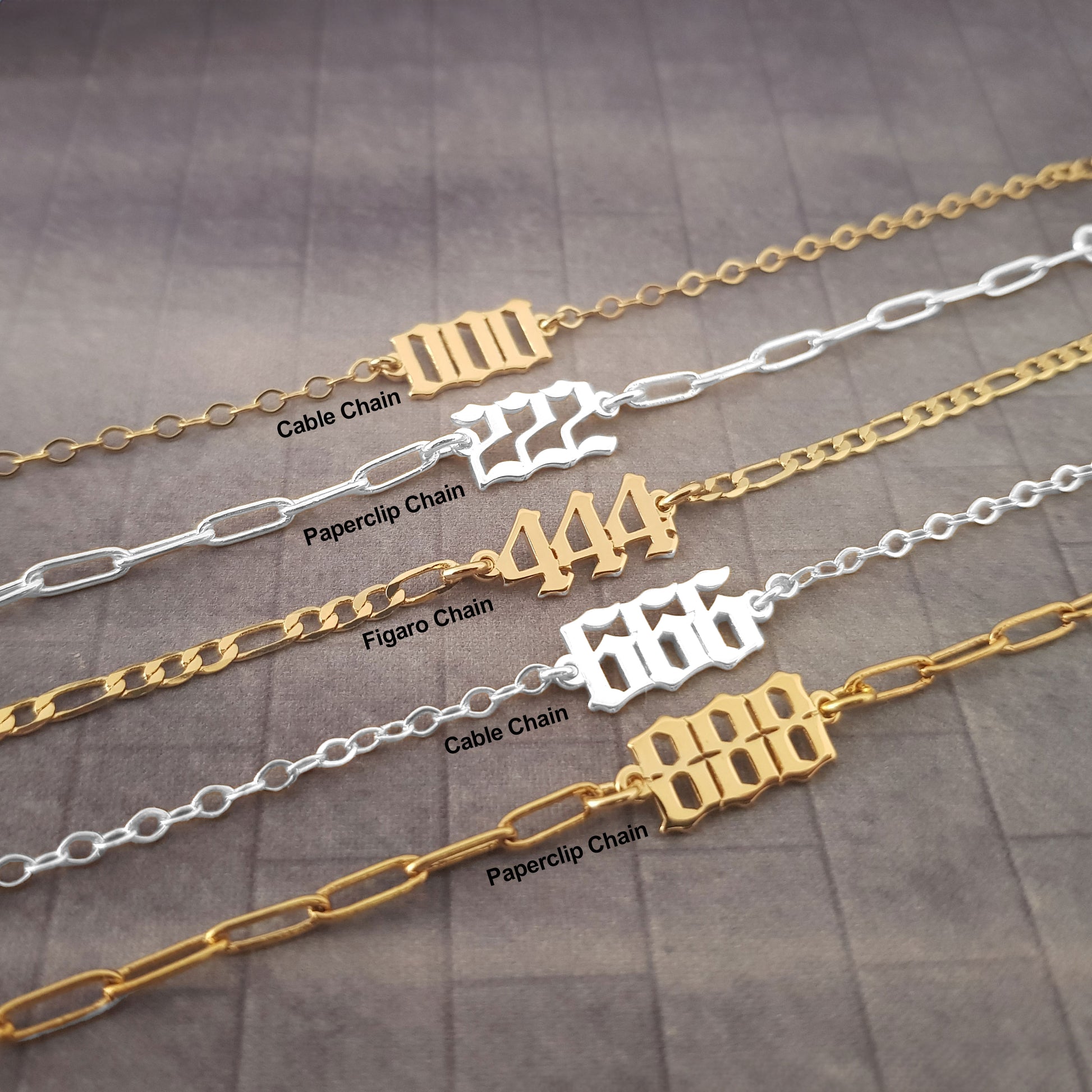 a row of gold and silver chains with numbers on them