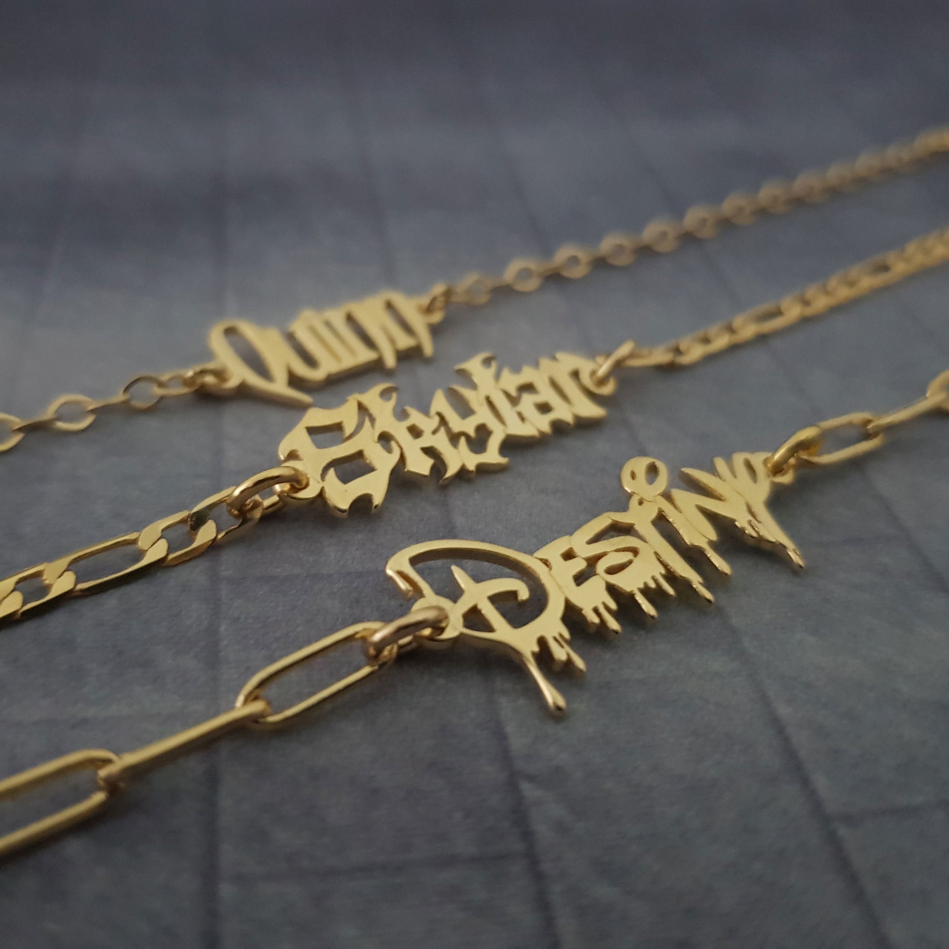 a couple of necklaces sitting on top of a table