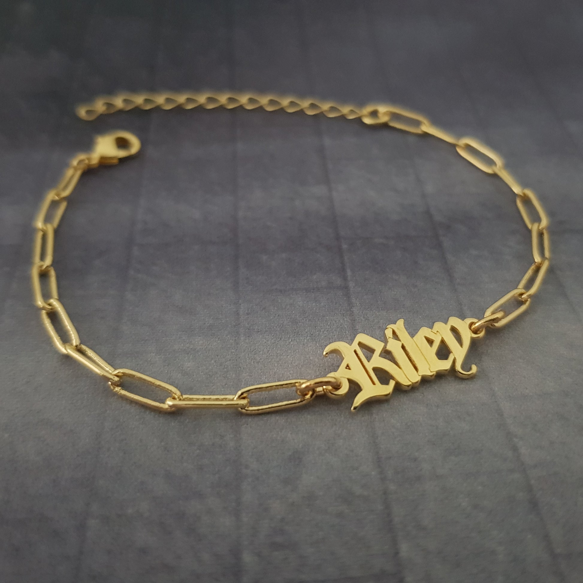 a gold bracelet with a name on it