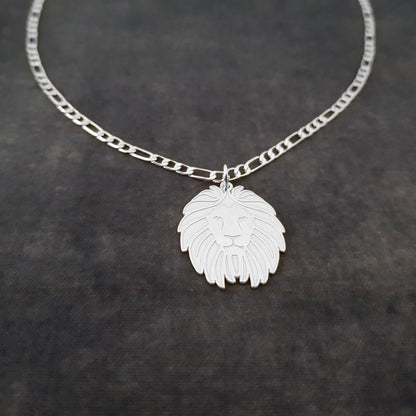 a necklace with a lion head on a chain