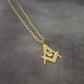 a gold necklace with a masonic symbol on it