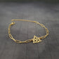 a gold bracelet with a celtic knot on it