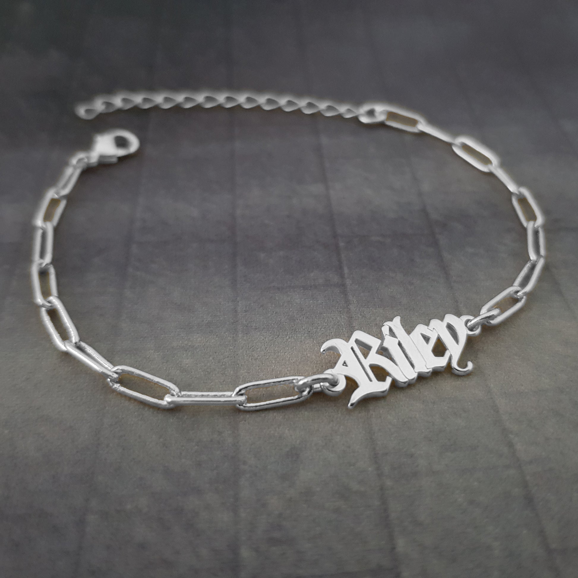 a silver bracelet with a name on it