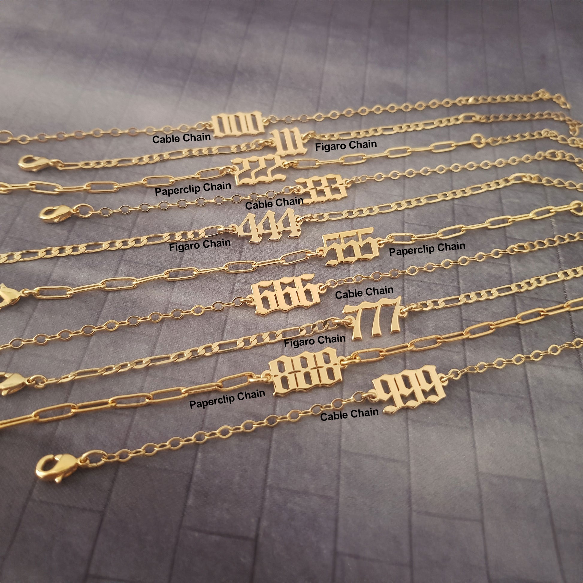 a bunch of gold chains with numbers on them