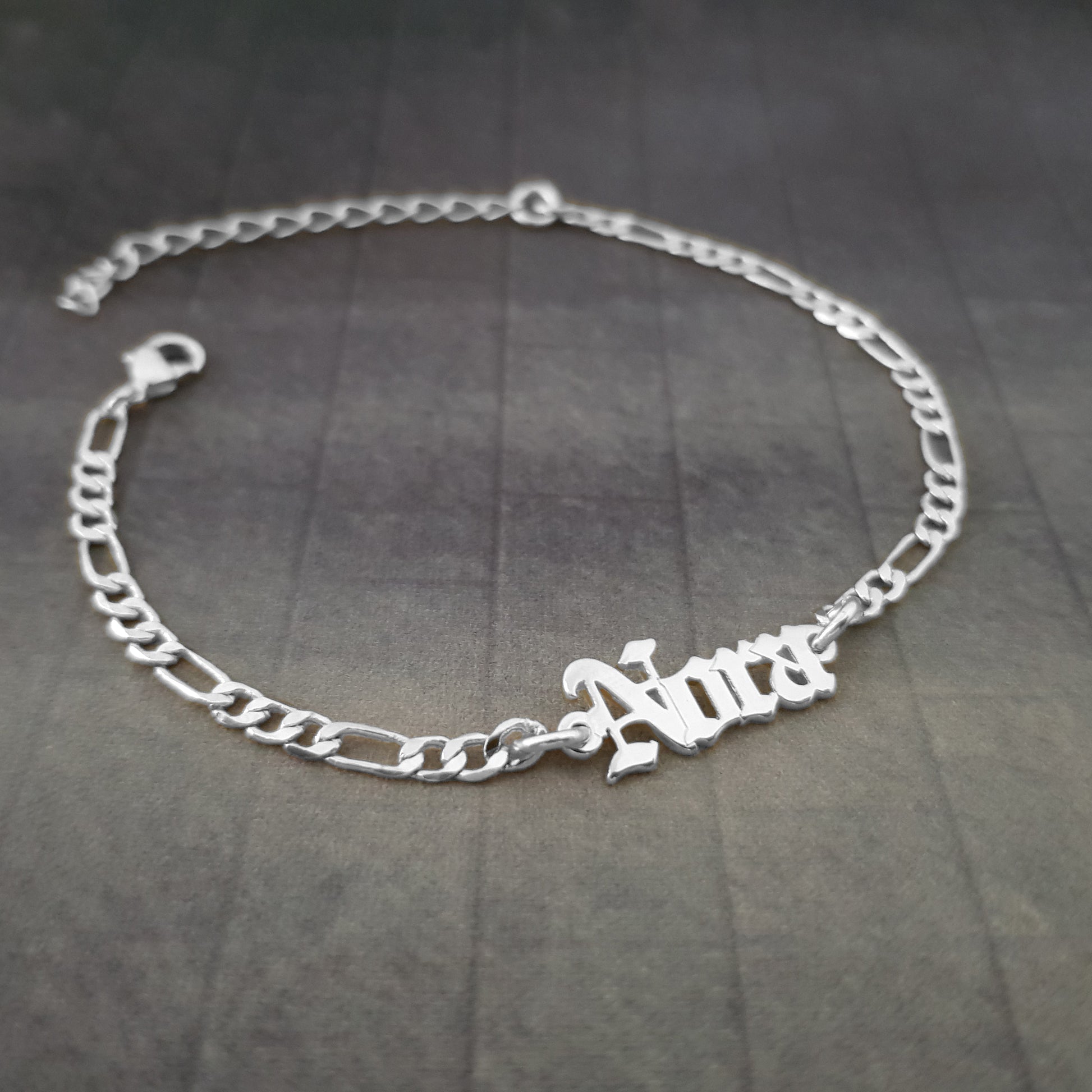 a silver bracelet with a name on it