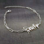 a silver bracelet with a name on it