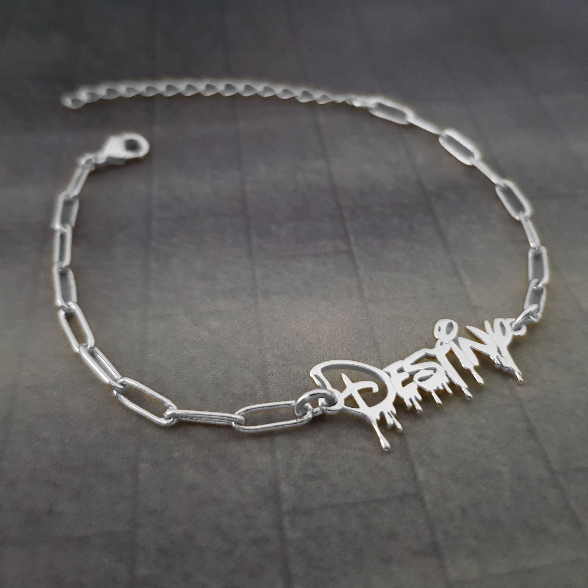 a silver bracelet with a name on it